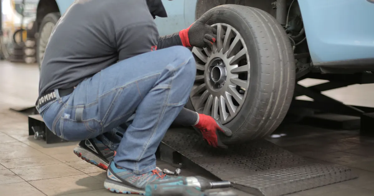 Flat tyre repair in Lahore - a mechanic fixing a puncture at the roadside