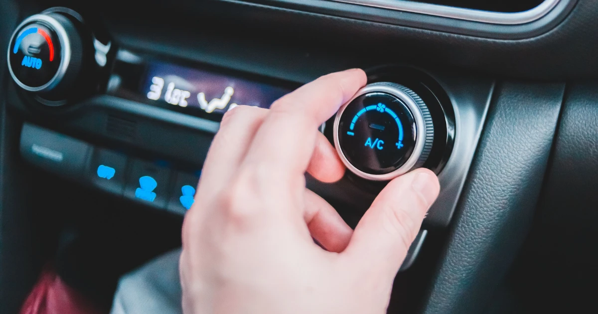 Car AC repair in Lahore - a mechanic servicing a car air conditioner at home